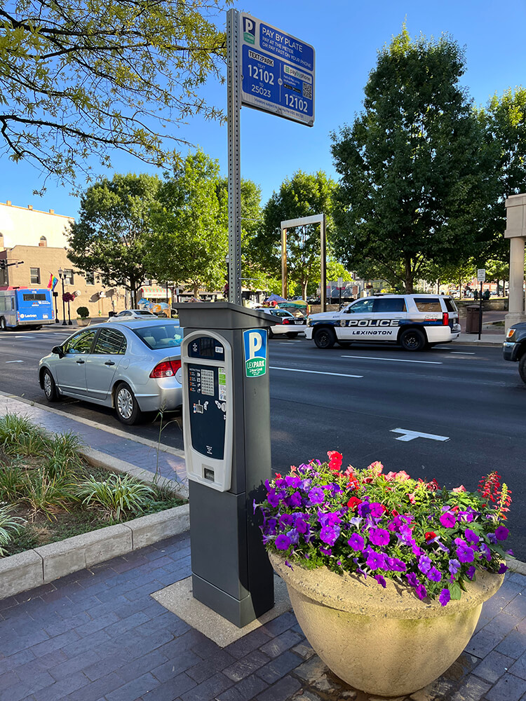 A T2 Systems pay station and mobile parking payment sign in Lexington, KY